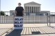 Activist Bill Christeson protests in front of the Supreme Court as decisions are announced, on Capitol Hill in Washington, Friday, June 21, 2024. The justices are still weighing whether former President Donald Trump is immune from criminal prosecution in the election interference case against him, roughly two months after hearing arguments. (AP Photo/J. Scott Applewhite)