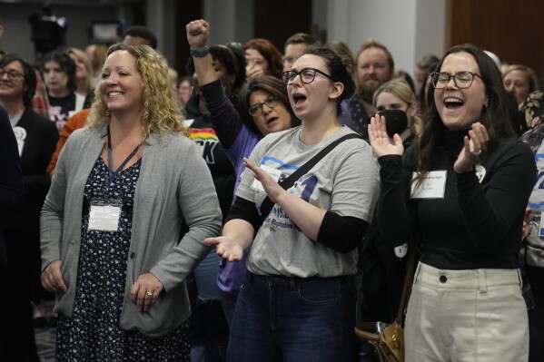 Supporters of Issue 1 cheer at a watch party, Tuesday, Nov. 7, 2023, in Columbus Ohio. (AP Photo/Sue Ogrocki)