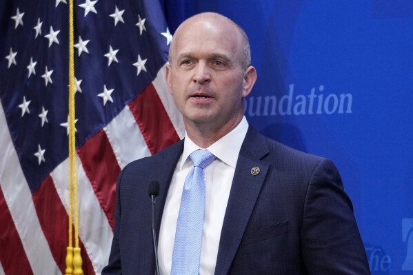 FILE - Kevin Roberts, president of The Heritage Foundation, speaks in Washington, April 12, 2023. Former President Donald Trump is seeking to distance himself from a plan for a massive overhaul of the federal government drafted by some of his administration officials. Some of these men are expected to take high-level roles if Trump is elected back into the White House. Roberts said that Republicans are “in the process of taking this country back” when he spoke Tuesday, July 2, 2024, on Steve Bannon's “War Room” podcast. (AP Photo/J. Scott Applewhite)