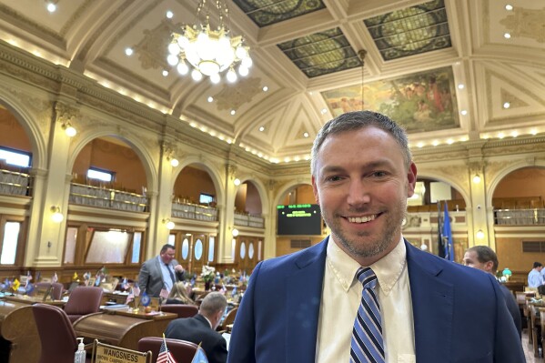 FILE - South Dakota Republican Rep. Jon Hansen stands in the House of Representatives in the state Capitol in Pierre, S.D., on Feb. 21, 2024. A judge rejected the lawsuit in a ruling Monday, July 15, 2024. (AP Photo/Jack Dura, File)