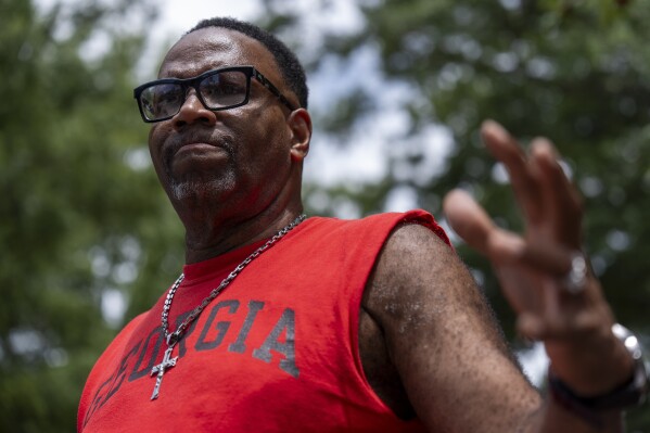 L.J. Boyd, 62, of Hastings, Fla., gestures during an interview with the Associated Press, Monday, July 22, 2024, in Atlanta. (AP Photo/Stephanie Scarbrough)