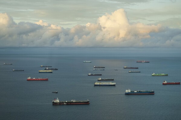 Cargo ships wait to transit the Panama Canal in Panama City, Friday, June 28, 2024. (AP Photo/Matias Delacroix)