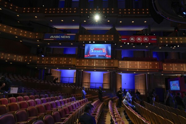 Journalists attend a walk-thrrough of the theater ahead of the third Republican presidential debate, Tuesday, Nov. 7, 2023, in Miami. Five hopefuls will participate in the debate at the Adrienne Arsht Center for the Performing Arts of Miami-Dade County, according to the Republican National Committee. They are Florida Gov. Ron DeSantis, businessman Vivek Ramaswamy, former U.N. Ambassador Nikki Haley, Sen. Tim Scott, R-S.C., and former New Jersey Gov. Chris Christie. (AP Photo/Rebecca Blackwell)