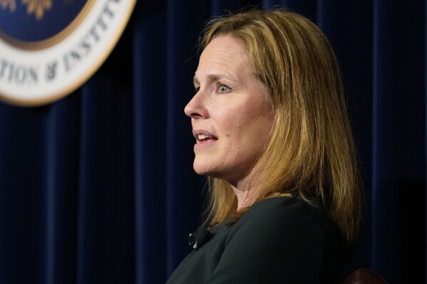 FILE - U.S. Supreme Court Associate Justice Amy Coney Barrett speaks at the Ronald Reagan Presidential Library Foundation in Simi Valley, Calif., April 4, 2022. Amy Coney Barrett has been a firm member of the conservative Supreme Court supermajority she cemented four years ago on issues ranging from abortion to guns, but her latest opinions reflect an increasing willingness to occasionally step away from that bloc.(AP Photo/Damian Dovarganes, File)