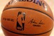 FILE - An NBA logo is seen on an official game ball before a basketball game, Feb. 1, 2014, in New York. The NBA said Wednesday, July 24, 2024 that it is not accepting Warner Bros. Discovery's $1.8 billion per year offer to continue its longtime relationship with the league and therefore has entered into a deal with Amazon Prime Video, a move that would mean this coming season would end a nearly four-decade run of games being on TNT. (AP Photo/Jason DeCrow, file)