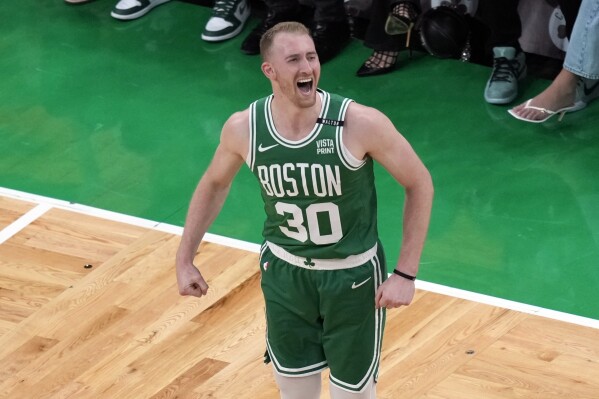 FILE - Boston Celtics' Sam Hauser reacts after making a 3-point basket during the first half of Game 5 of the NBA basketball finals against the Dallas Mavericks, June 17, 2024, in Boston. The Boston Celtics locked up another member of their championship core on Sunday, July 21, agreeing to a four-year, $45 million extension with Hauser, a person with knowledge of the details said. (AP Photo/Michael Dwyer, File)