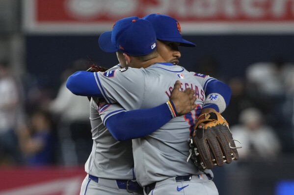 New York Mets' Francisco Lindor and Jose Iglesias celebrate after winning a baseball game against the New York Yankees, Wednesday, July 24, 2024, in New York. (AP Photo/Pamela Smith)