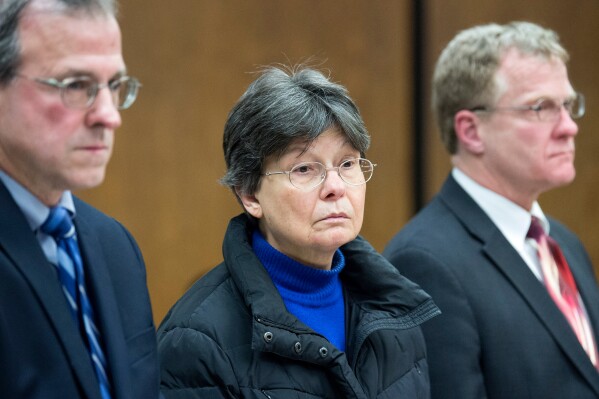 FILE - Linda Kosuda-Bigazzi, 70, center, appears at Bristol Superior court, accused of murdering her husband, Dr. Pierluigi Bigazzi, in Bristol, Conn., on Feb. 13, 2018. (Patrick Raycraft/Hartford Courant via AP, Pool, File)