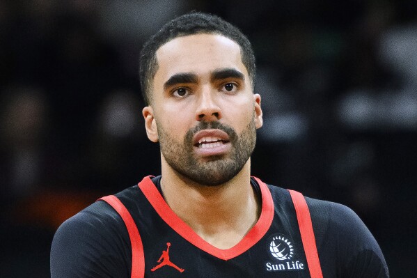 FILE - Toronto Raptors forward Jontay Porter looks on during the first half of the team's NBA basketball game against the Chicago Bulls, Jan. 18, 2024, in Toronto. The former NBA player is due in court Wednesday, July 10, to face a federal criminal case tied to the betting scandal that got him banned from the league earlier this year. (Christopher Katsarov/The Canadian Press via AP, File)