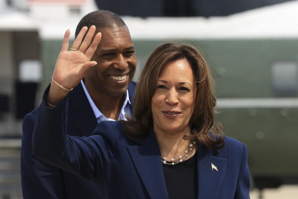 Vice President Kamala Harris waves before boarding Air Force Two as she departs on campaign travel to Milwaukee, Wisc., Tuesday, July 23, 2024 at Andrews Air Force Base, Md. (Kevin Mohatt/Pool via AP)