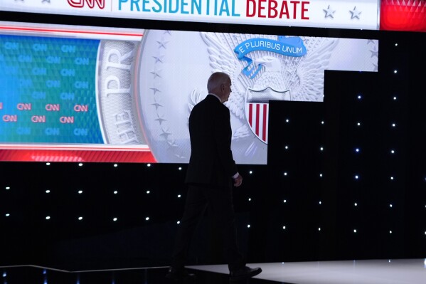 President Joe Biden walks from the stage during a break in a presidential debate with Republican presidential candidate former President Donald Trump Thursday, June 27, 2024, in Atlanta. (AP Photo/Gerald Herbert)