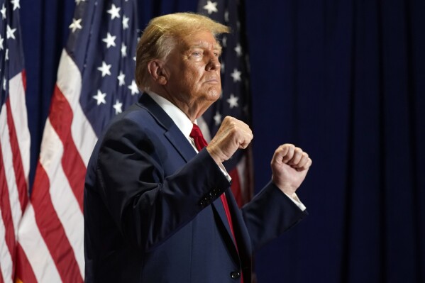 FILE - Republican presidential candidate former President Donald Trump gestures at a campaign rally, March 2, 2024, in Richmond, Va. The Supreme Court has restored Donald Trump to 2024 presidential primary ballots, rejecting state attempts to hold the Republican former president accountable for the Capitol riot. The justices ruled a day before the Super Tuesday primaries that states cannot invoke a post-Civil War constitutional provision to keep presidential candidates from appearing on ballots. (AP Photo/Steve Helber, File)