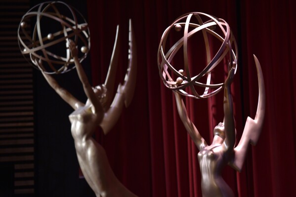 FILE - Emmy statues appear on stage at the 70th Primetime Emmy nominations announcement in Los Angeles on July 12, 2018. (Photo by Chris Pizzello/Invision/AP, File)
