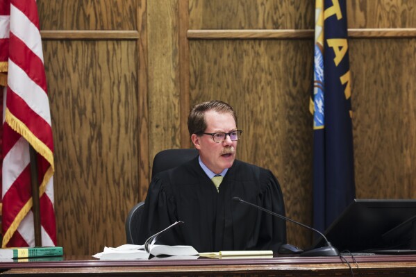 Lewis and Clark District Court Judge Mike Menehan speaks during a temporary restraining order hearing in a suit against the Montana Secretary of State brought by Montanans Securing Reproductive Rights and Montanans for Election Reform over ballot initiative signature exclusions on Tuesday, July 16, 2024 at the Lewis and Clark County Courthouse in Helena, Mont. (Thom Bell/Independent Record via AP)