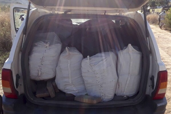 FILE - This photo released by Mexico's National Security Commission shows bags of illegal drugs, including 100 pounds (45.5 kilograms) of fentanyl, according to authorities, inside a sports utility vehicle after police stopped the car for a missing front license plate near Ensenada, Baja California, Mexico, Jan. 25, 2018. As Mexican-made fentanyl continues to flood into the U.S., Mexico’s efforts to seize the drug have declined dramatically, according to figures made public on Tuesday, July 9, 2024. (Mexico's National Security Commission via AP, File)