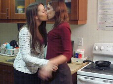 Dani Daniels kissing Amber Rayne at work gif