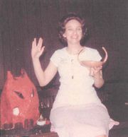 Jacqueline Lichtenberg holding the Kraith made by a fan and giving the Vulcan Salute