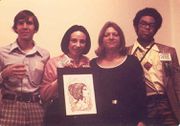 "Gee Moaven presented Jacqueline Lichtenberg with this ink drawing of a character from the Kraith Series, Spock's half-sister. Many fans protested adding a half-sibling to Spock's family -- interestingly enough Spock acquired a half-brother in one of the films, decades later."[22] Fans pictured from left to right: unknown male fan, Jacqueline Lichtenberg, Gee Moaven, Winston A. Howlett