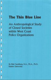 Fake front cover of Jim and Blair Do the World (2000), a Sentinel zine. This issue has a cover that reads: "The Thin Blue Line: An Anthropological Study of Closed Societies within West Coast Police Organizations" The author is listed as "Blair Sandburg, B.A., M.A., Ph.D., Rainier University".