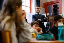 French President Emmanuel Macron meets with Third Grade pupils (CE2) during a visit to the Ecole primaire d'application Blanche and the Laboratoire académique de formation autisme (LAB9A) in on April 5, 2024. Three days after the National Autism Day, Macron visits LAB9A, a teacher training centre for autistic children recently set up by the Paris education authority, also meeting pupils and teachers at Blanche primary school, which has had an autism teaching unit (UEEA) since the start of the 2023 academic year. (Photo by Ludovic MARIN / POOL / AFP)