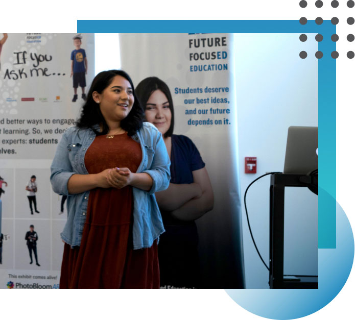 Decorative photo of woman speaking at conference event