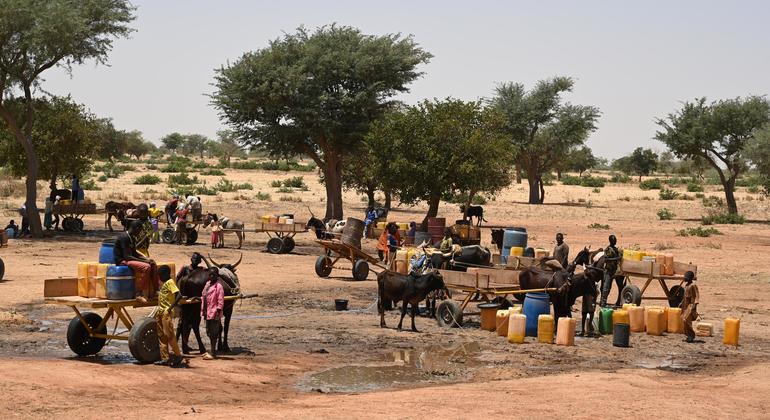 Children and women collect water in a village in Niger. (file)