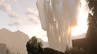 John-117 watches a Reformation Spire rise from the surface of Zeta Halo.