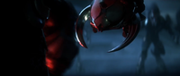 Atriox holding a spiked Sangheili helmet in Halo Wars 2.