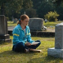 Max from Stranger Things sits before brother Billy's grave in Season 4