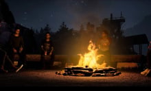 Teen horror movie characters sit around the camp fire in "The Quarry" video game