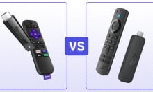 A Roku and Amazon Fire TV stick on a purple background with a versus symbol.