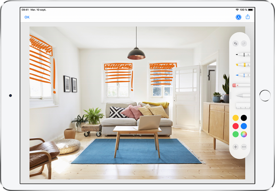 Une photo est annotée avec des lignes orange pour indiquer les stores au-dessus des fenêtres. Des outils de dessins et des sélections de couleurs apparaissent sur le côté droit de l’écran.