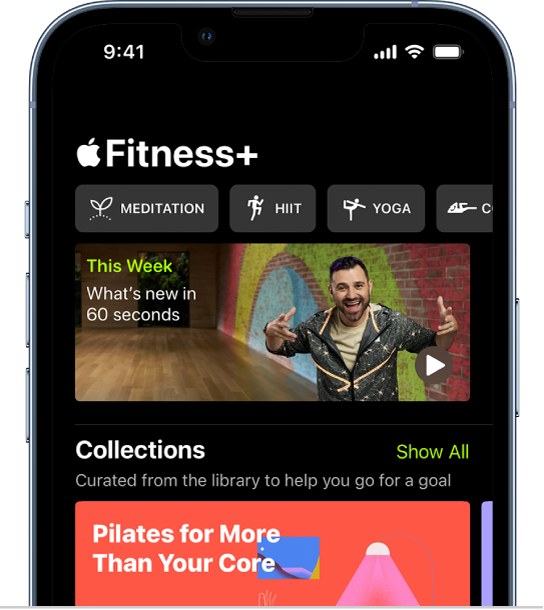 The Apple Fitness  screen showing, from left to right, different types of workouts in the top row. The This Week area plays a 60 second video of workouts, trainers, and workout programs that are new to Apple Fitness .