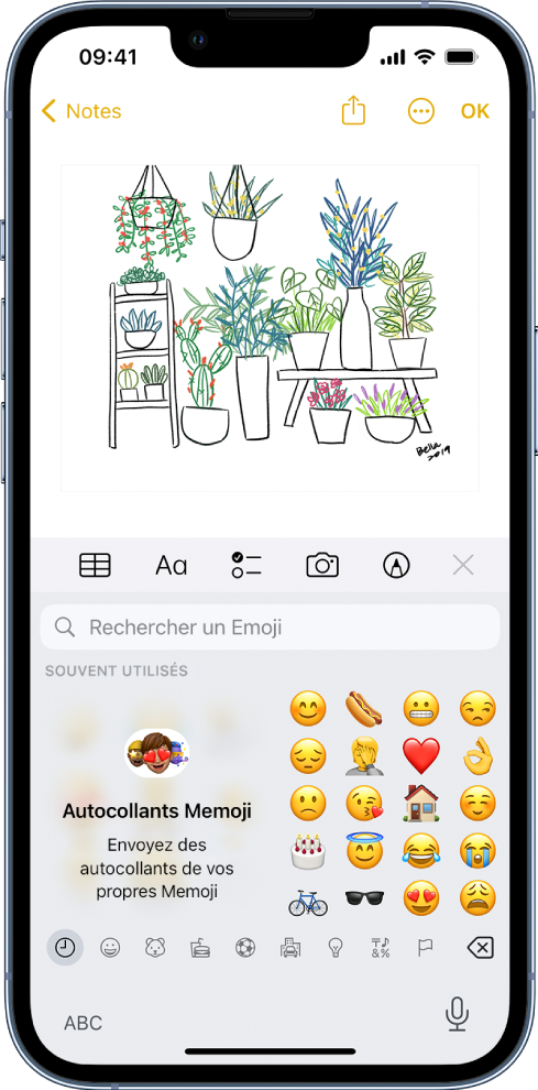 Note en cours de modification dans l’app Notes, avec le clavier Emoji ouvert et le champ « Rechercher un Emoji » en haut du clavier.