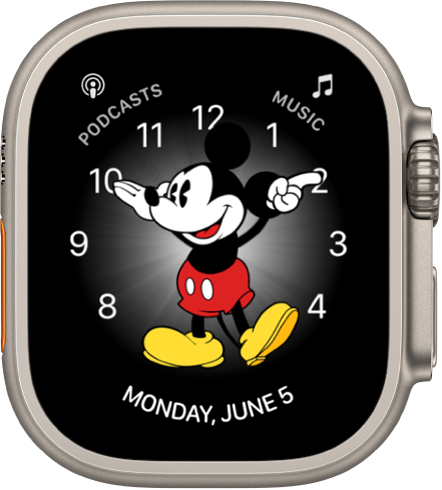 The Mickey Mouse watch face where you can add many complications. It shows three complications: Podcasts at the top left, Music at the top right, and Date at the bottom.