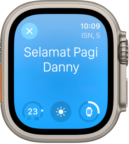 Apple Watch menunjukkan skrin bangun tidur. Perkataan Selamat Pagi kelihatan di bahagian atas. Paras bateri di bawah.