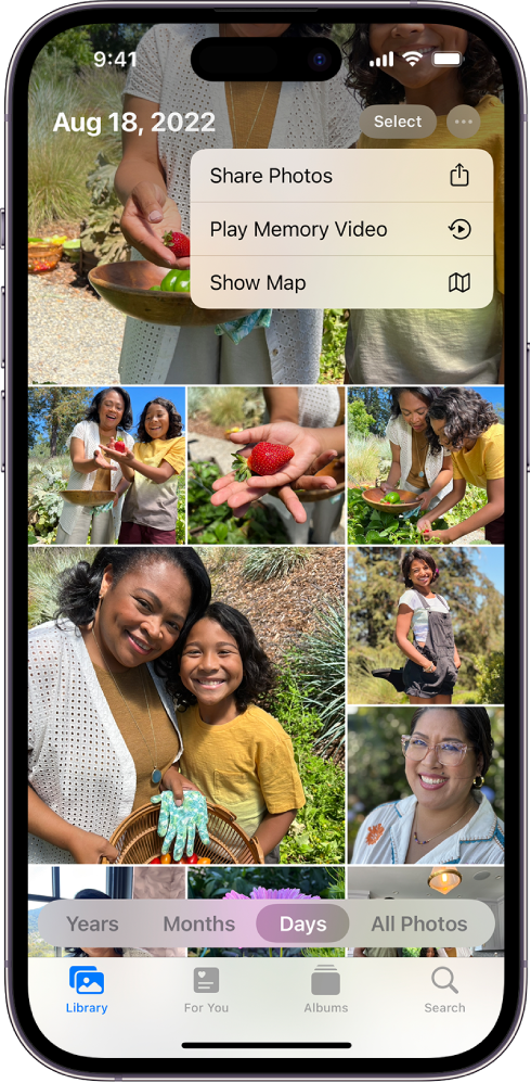 Ekrani Photos tregon bibliotekën e fotove; në fund të ekranit është zgjedhur Days. Menyja More options është e hapur në krye të ekranit dhe tregon opsionet Share Photos, Play Memory Video dhe Show Map.