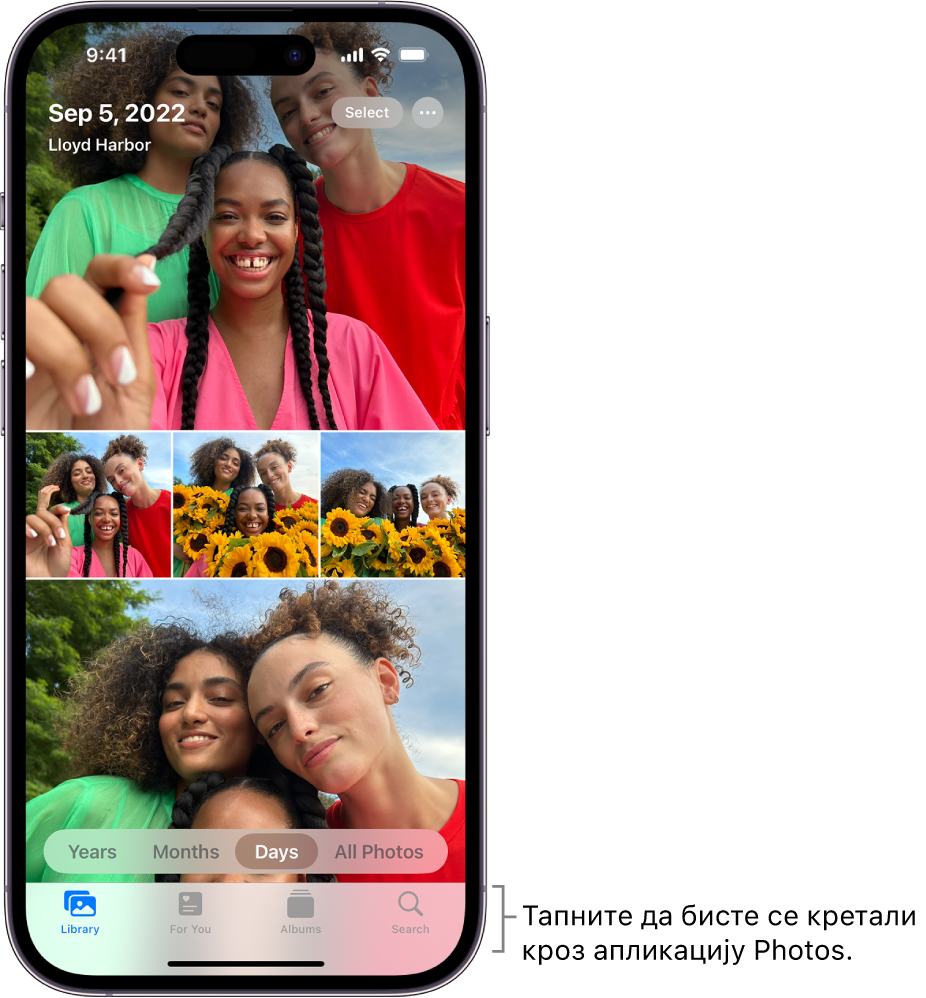 Библиотека фотографија приказана у приказу Days. Избор сличица фотографија попуњава екран. У горњем левом углу екрана су датум и локација где су снимљене фотографије. У горњем десном углу су дугмад Select и More Options за дељење фотографија и приказ детаља. Испод сличица су опције приказа библиотеке фотографија Years, Months, Days и All Photos. Дуж доње ивице су дугмад Library, For You, Albums и Search.