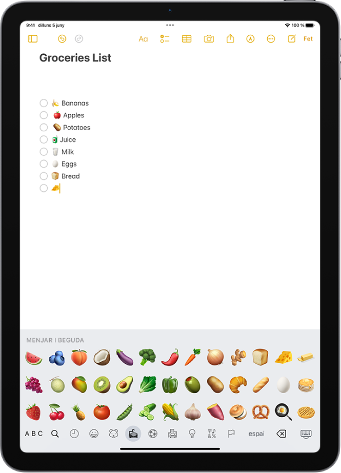 A la part superior de la pantalla de l’app Notes hi ha una nota oberta i, a la part inferior, el teclat d’emojis.