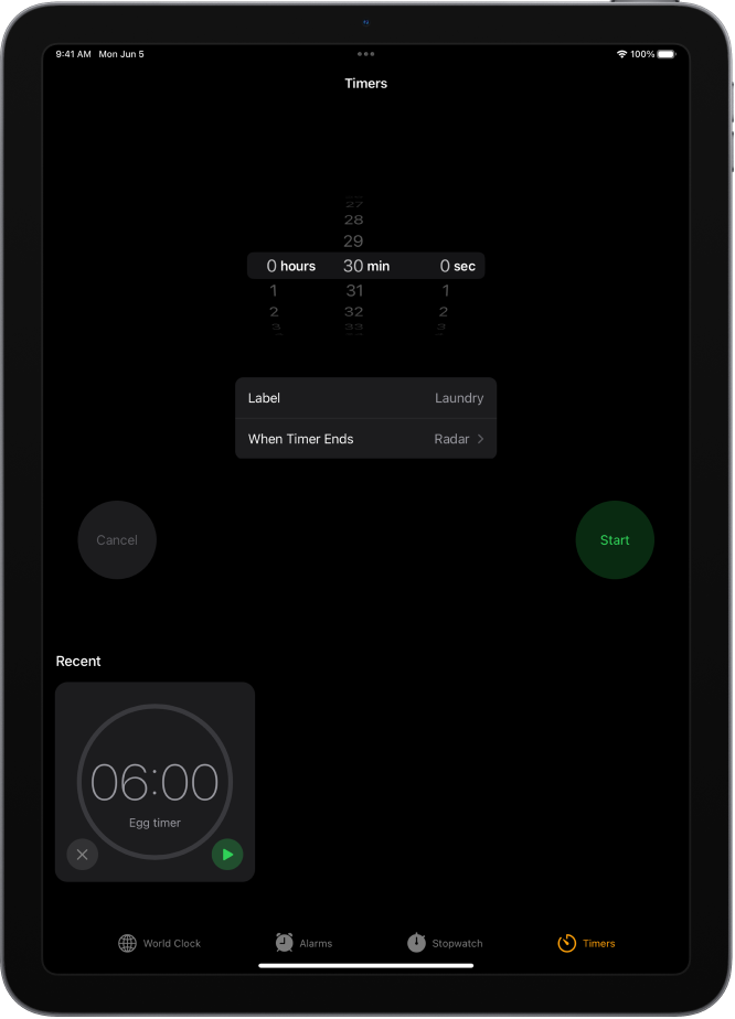 The Timers tab showing settings to set a timer. A recently created timer is below the timer settings. The World Clock, Alarm, Stopwatch, and Timers buttons are along the bottom.