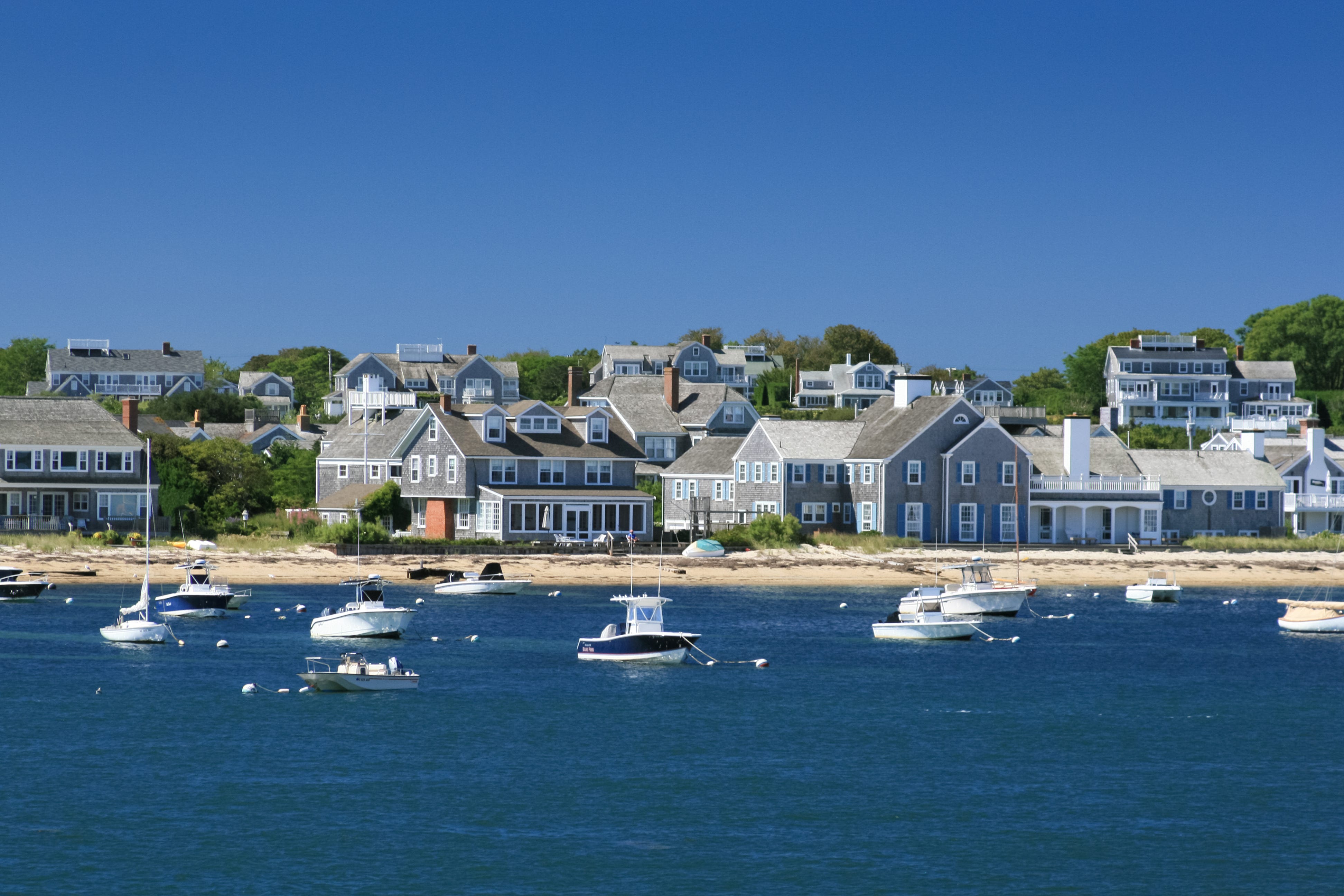 boats and waterfront houses, nantucket, massachusetts clear blue sky