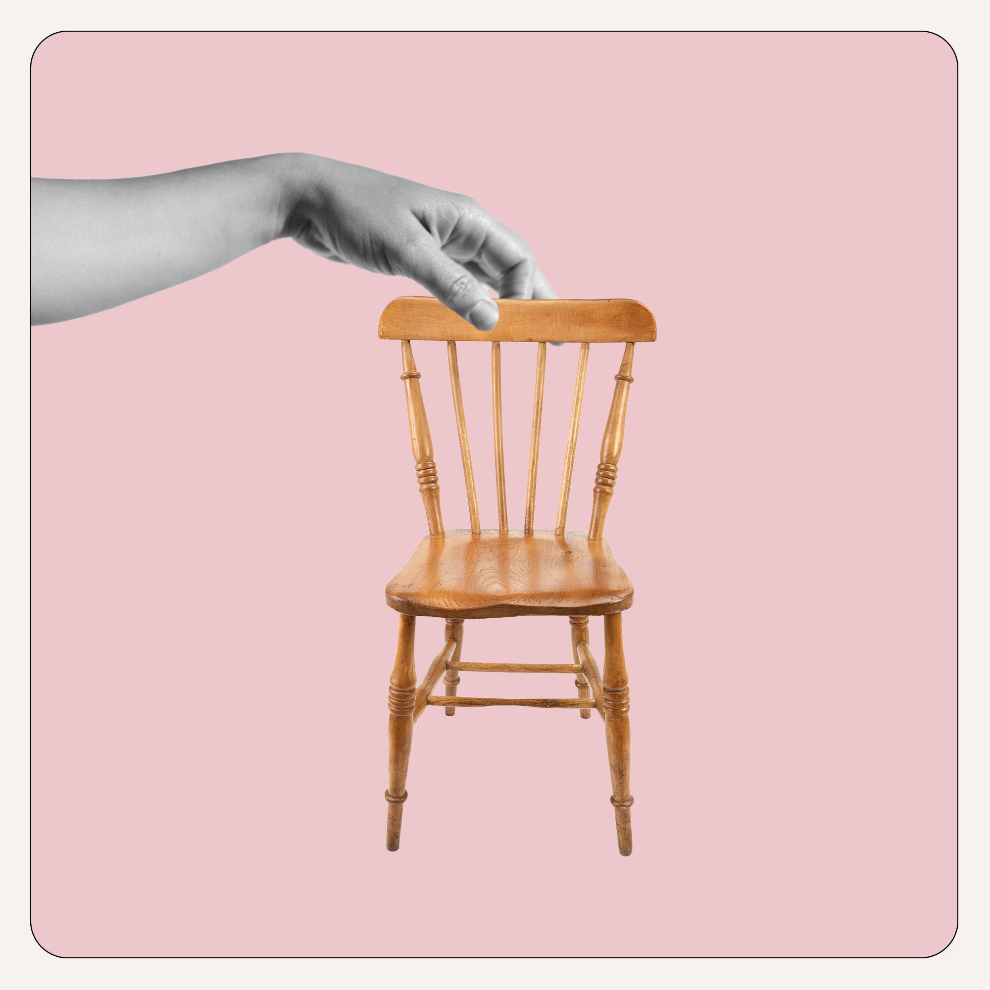 a hand on a chair