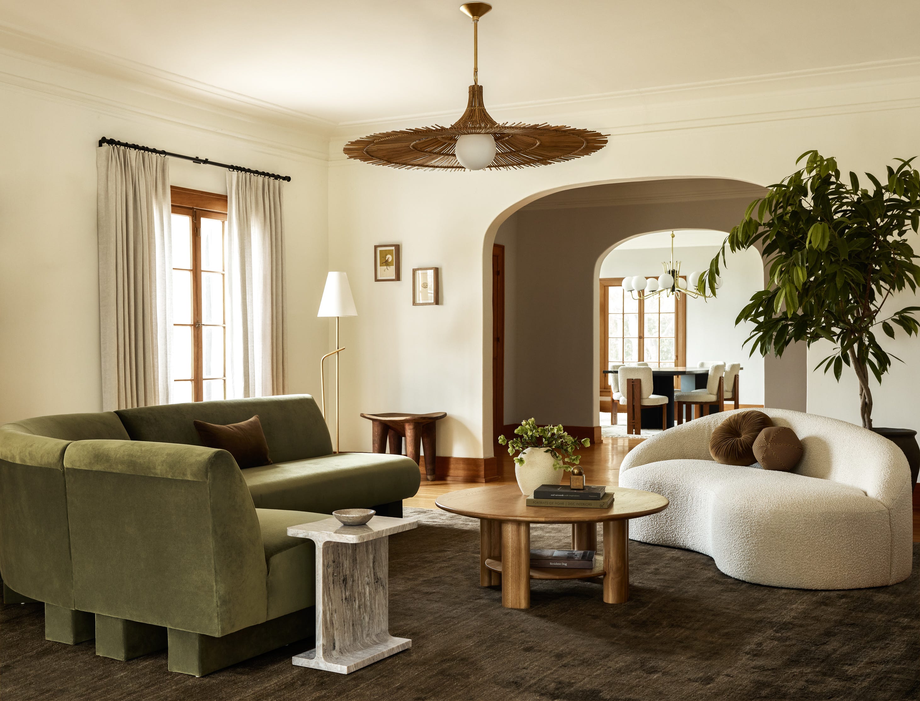 a living room with a chandelier and couches