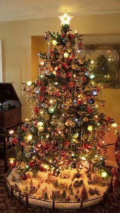 This may contain: a decorated christmas tree in a living room