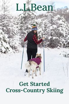 a woman is cross country skiing with her dog