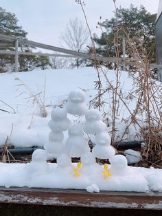 This may contain: the snow is piled on top of each other