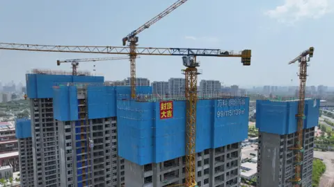 Getty Images Aerial photo shows a building under construction in Nanjing, Jiangsu province, 17 May, 2024.