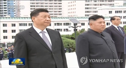 金正恩同习近平就朝中建交75周年互致贺电