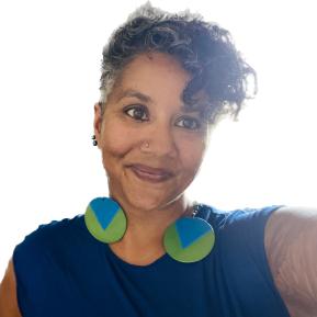 image of female with short hair wearing a blue top