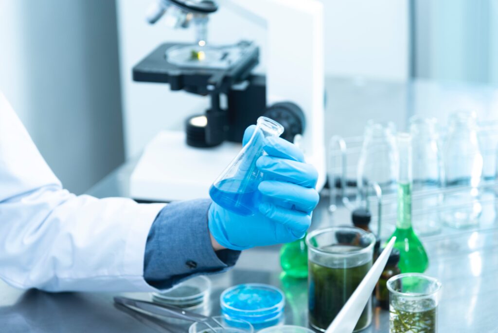 Medical researcher holding a flask in a Lab